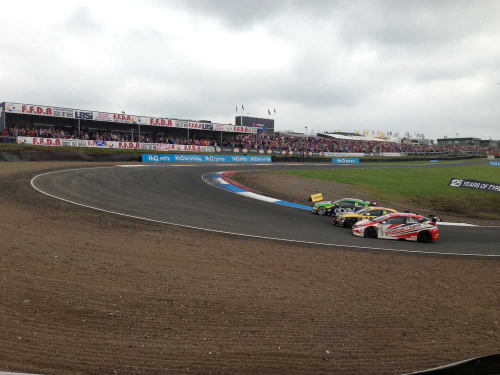 Turkington takes the lead in race one from Austin, closely followed by Shedden
